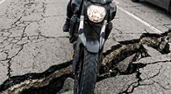The Pothole That Annoys a Driver Can Terrify a Rider