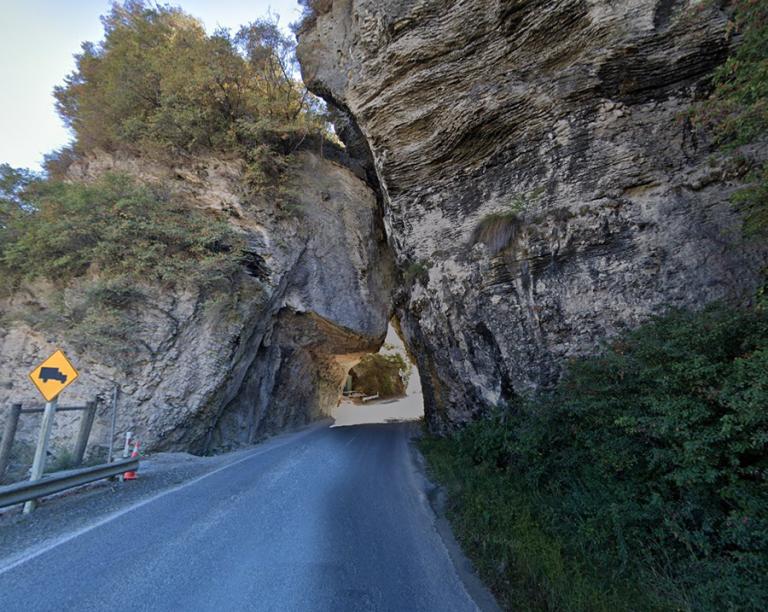 Driving through the Pohara Natural Bridge in the South Island
